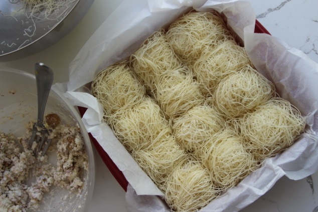 Kadaif nests arranged in a tray from above