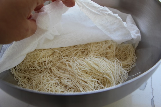 uncovering Kadaif dough in a bowl